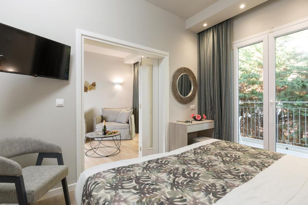 Postel nebo postele na pokoji v ubytování Melina Oasis Boutique Hotel