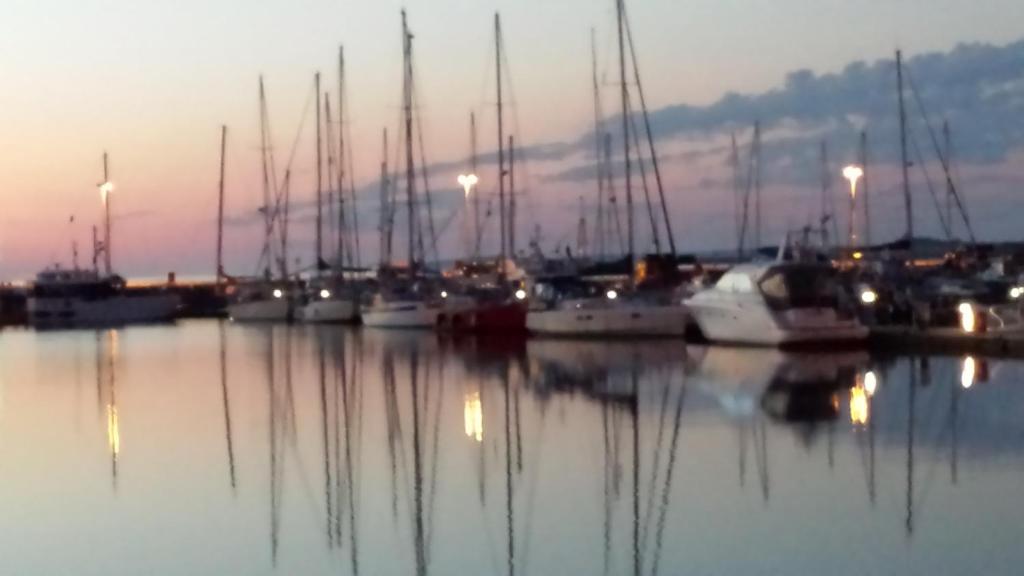 a group of boats docked in a marina at night at Bellavista Guest House in Kirkwall