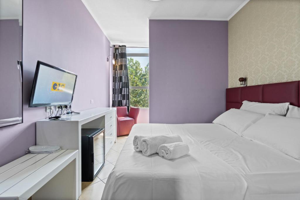 Postel nebo postele na pokoji v ubytování Hotel Relax