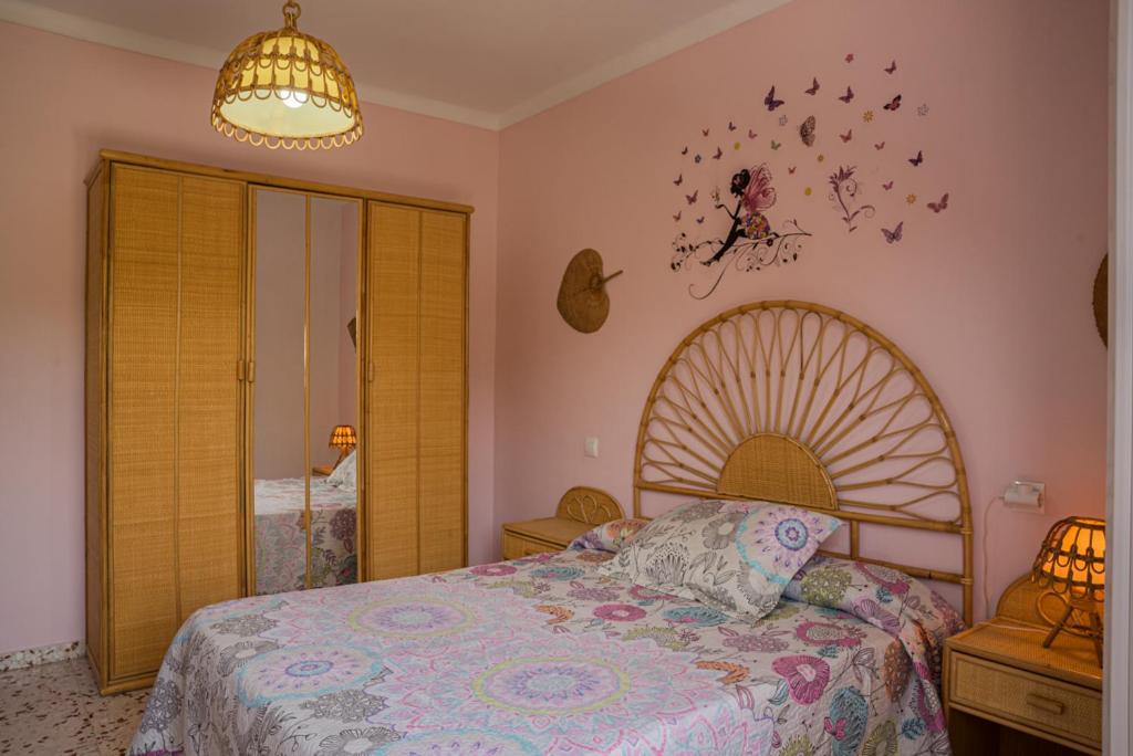 Postel nebo postele na pokoji v ubytování Casa Rural El Níspero