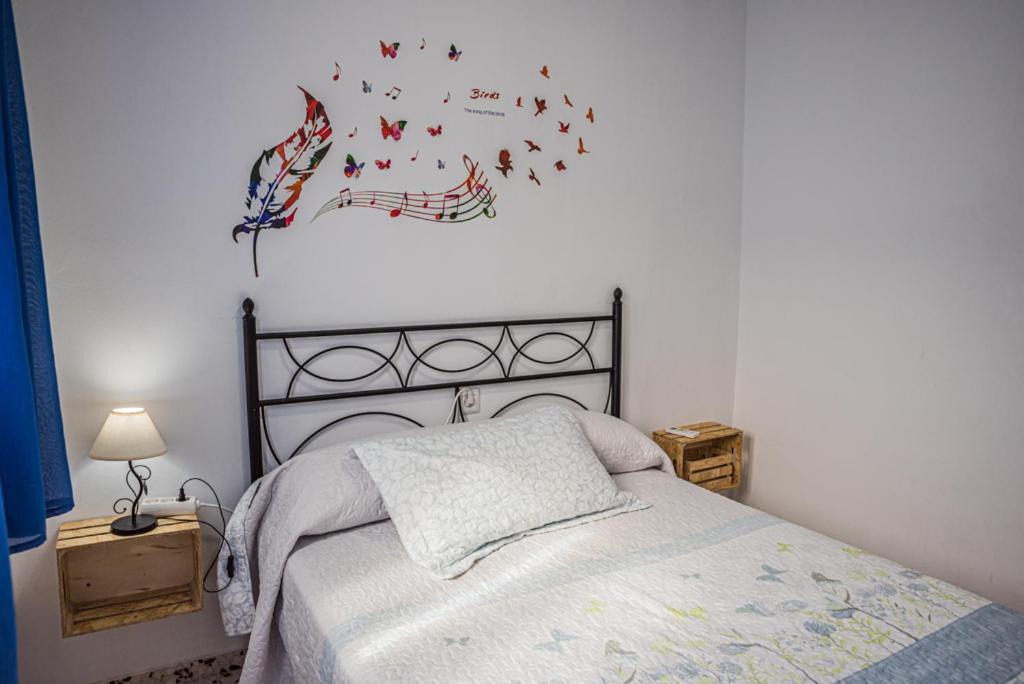 Postel nebo postele na pokoji v ubytování Casa Rural El Níspero