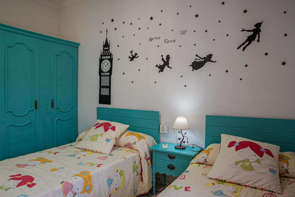 Postel nebo postele na pokoji v ubytování Casa Rural El Níspero