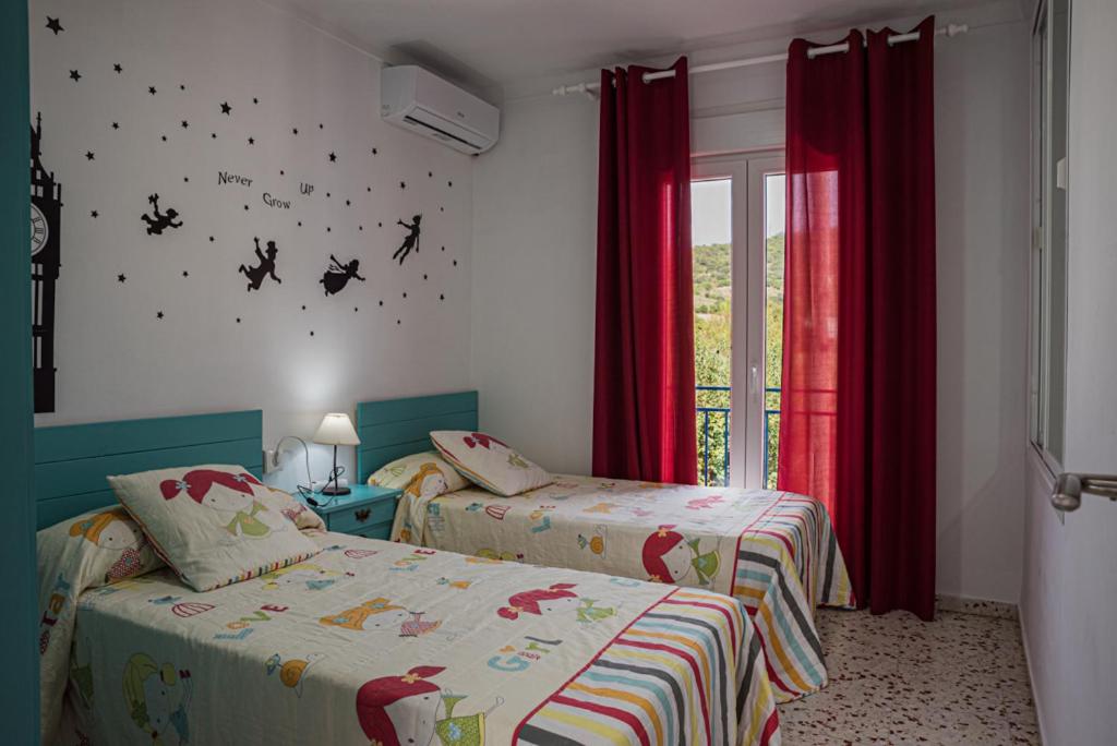 Postel nebo postele na pokoji v ubytování Casa Rural El Níspero