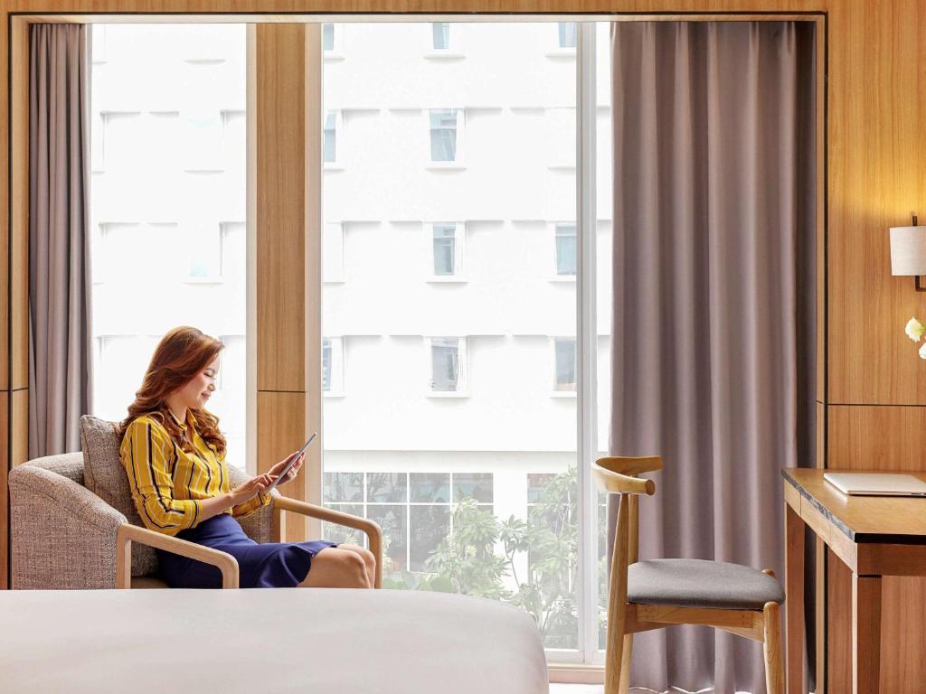 Postel nebo postele na pokoji v ubytování Mercure Samarinda