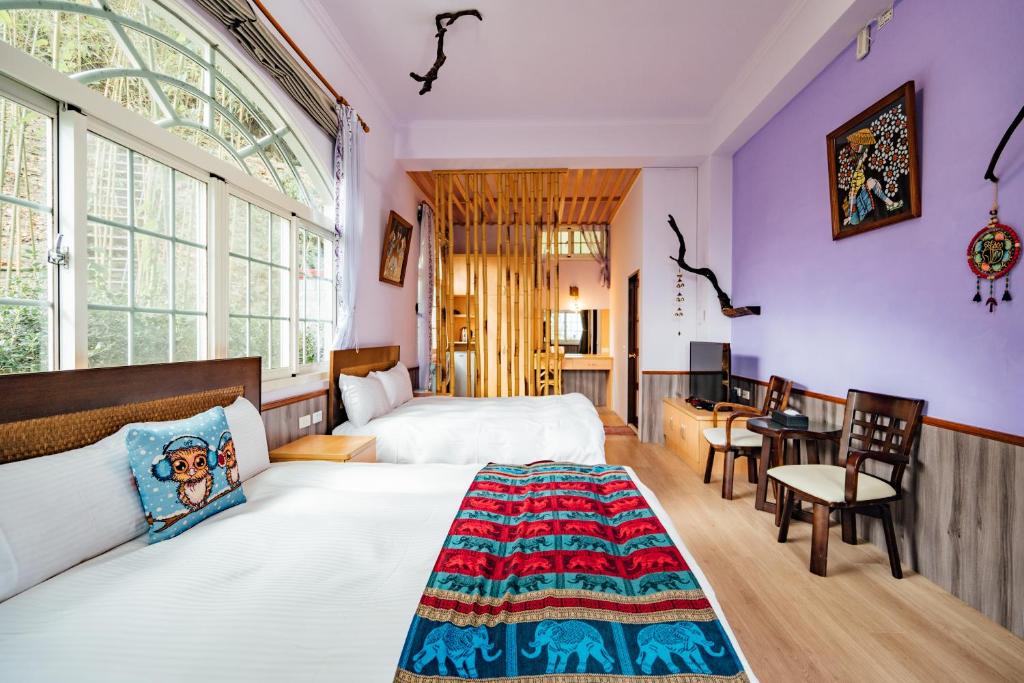 Postel nebo postele na pokoji v ubytování Yunnan Homestaty