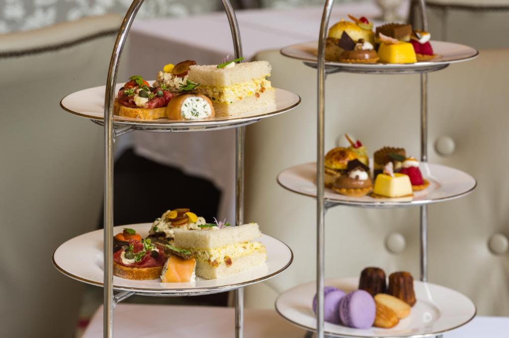 a tiered display of desserts and pastries on plates at The Rittenhouse Hotel in Philadelphia