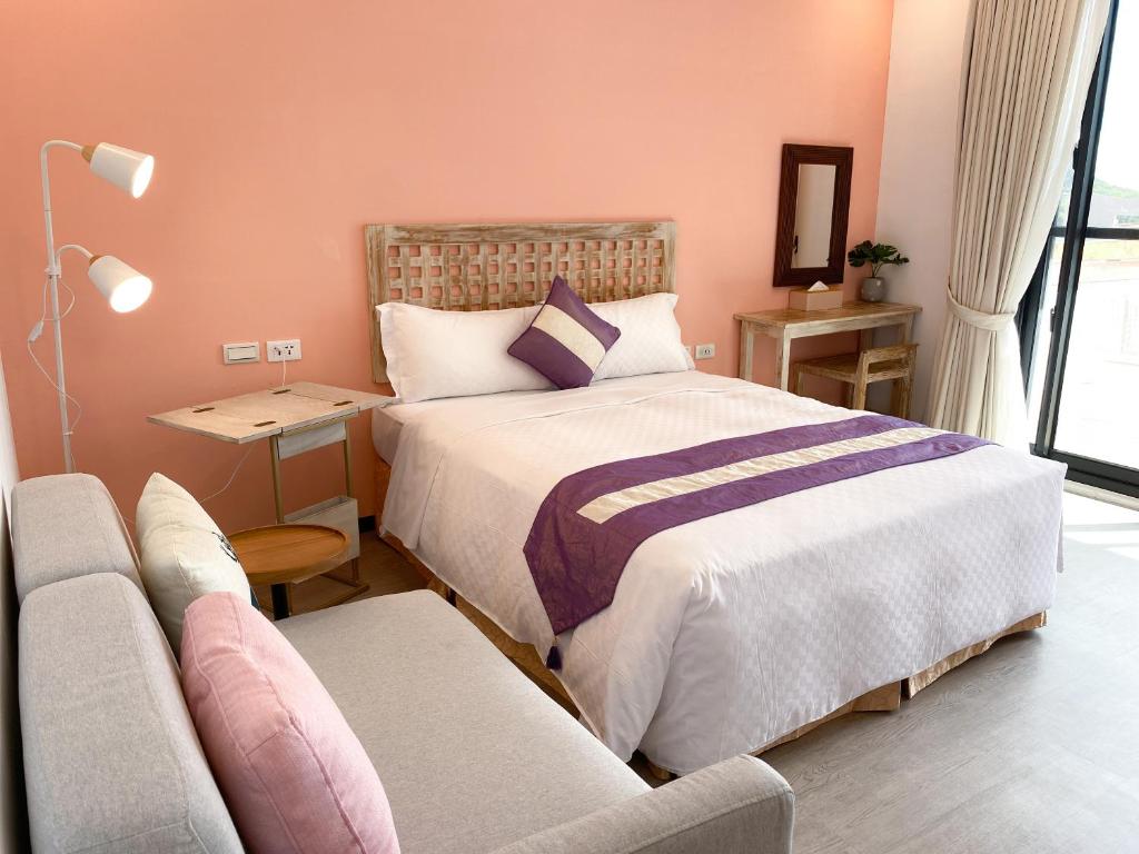 Postelja oz. postelje v sobi nastanitve Kenting Sunhow Inn