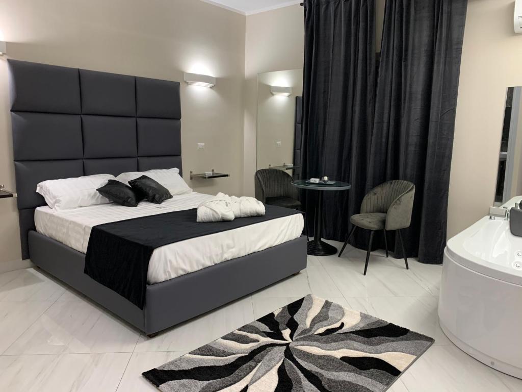 Postel nebo postele na pokoji v ubytování Hotel Trionfal