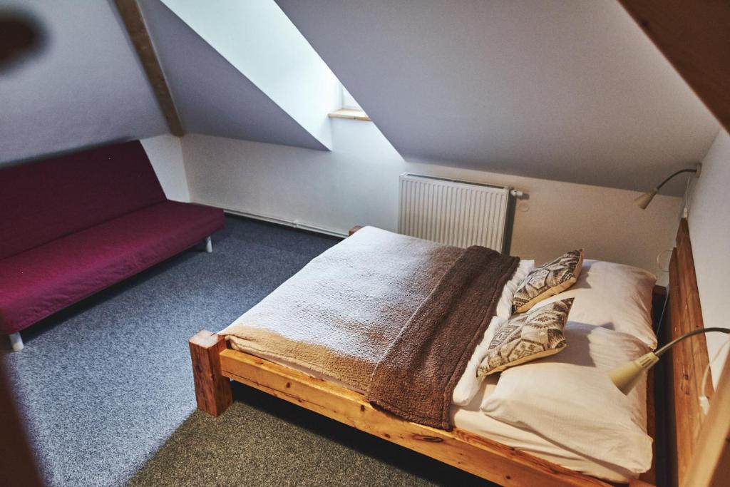 Postel nebo postele na pokoji v ubytování Apartmány Na Faře