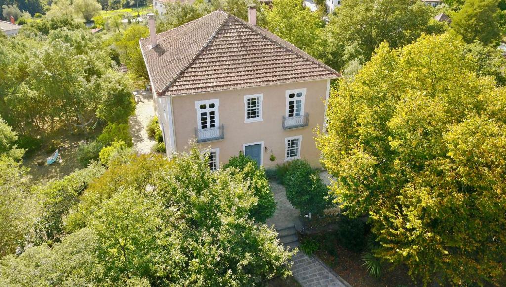 an overhead view of a house with trees at Casa do Cabeço in Caramulo