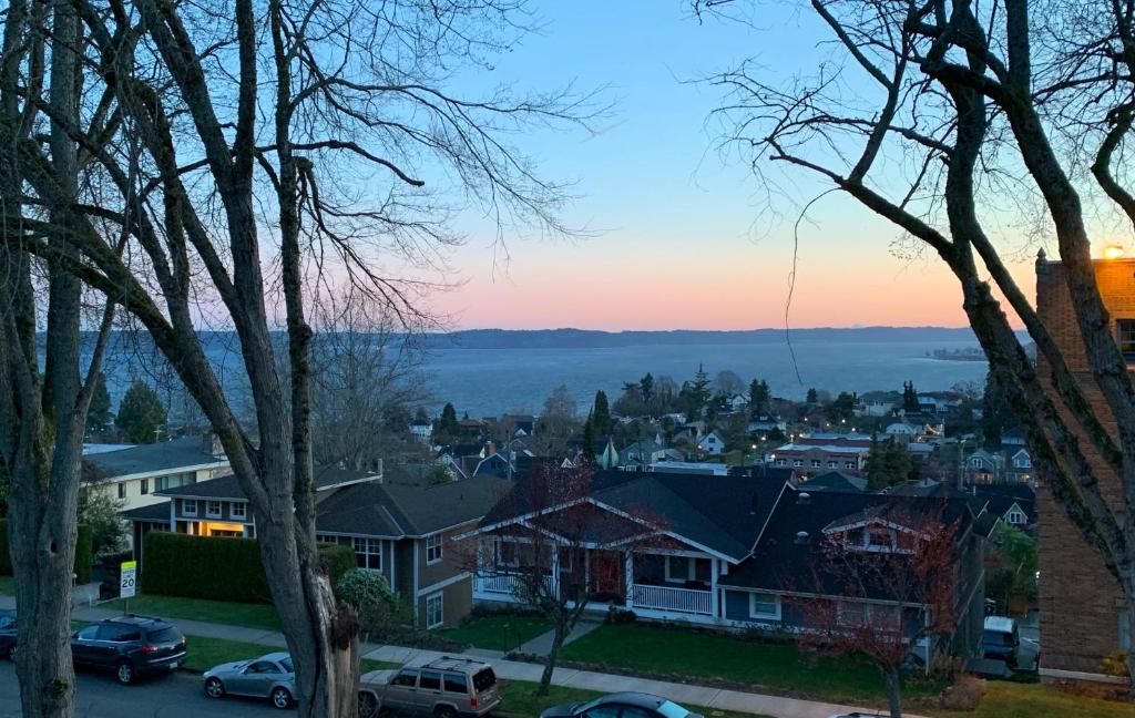 a view of a town at sunset with houses at Bay View, Best Area, No Stairs, WD, 2 Baths, 2 Bedrooms, Balcony, View, 925sf in Tacoma