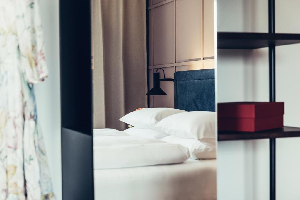 Letto o letti in una camera di Hotel Dermuth Klagenfurt