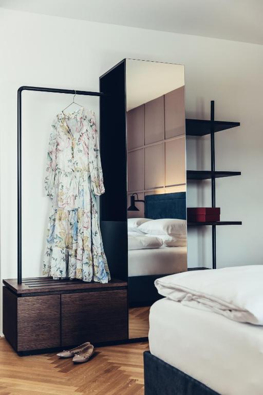 Letto o letti in una camera di Hotel Dermuth Klagenfurt