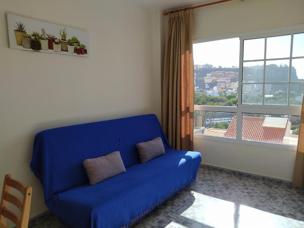 A seating area at apartamentos la villa 2