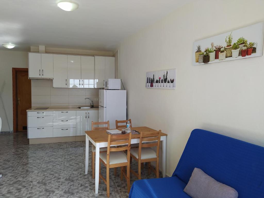 A kitchen or kitchenette at apartamentos la villa 2