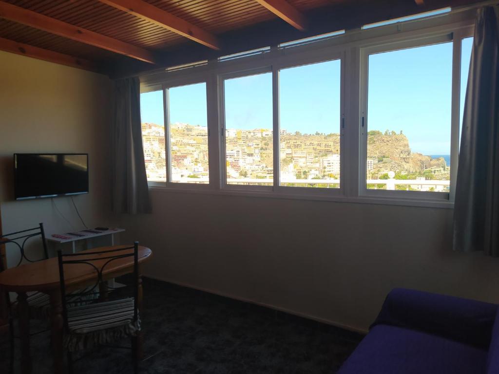 A television and/or entertainment centre at apartamentos la villa 2