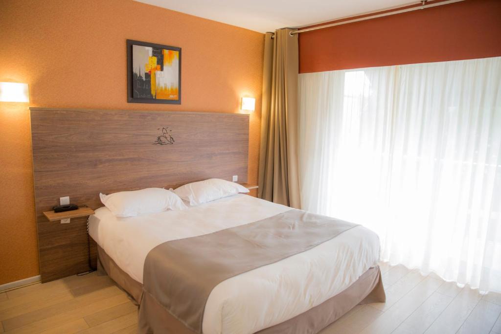 Postel nebo postele na pokoji v ubytování Arc Hôtel Sur Mer