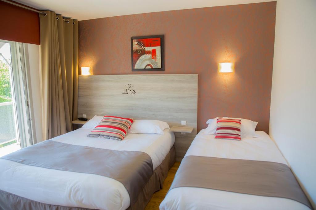 Postel nebo postele na pokoji v ubytování Arc Hôtel Sur Mer