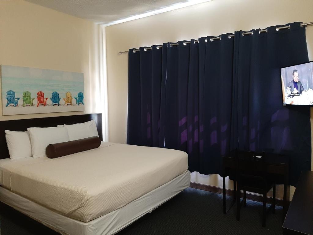 Postel nebo postele na pokoji v ubytování Hotel Villa del Sol