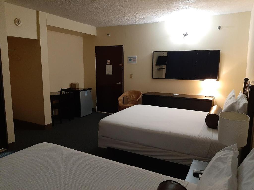 Postel nebo postele na pokoji v ubytování Hotel Villa del Sol