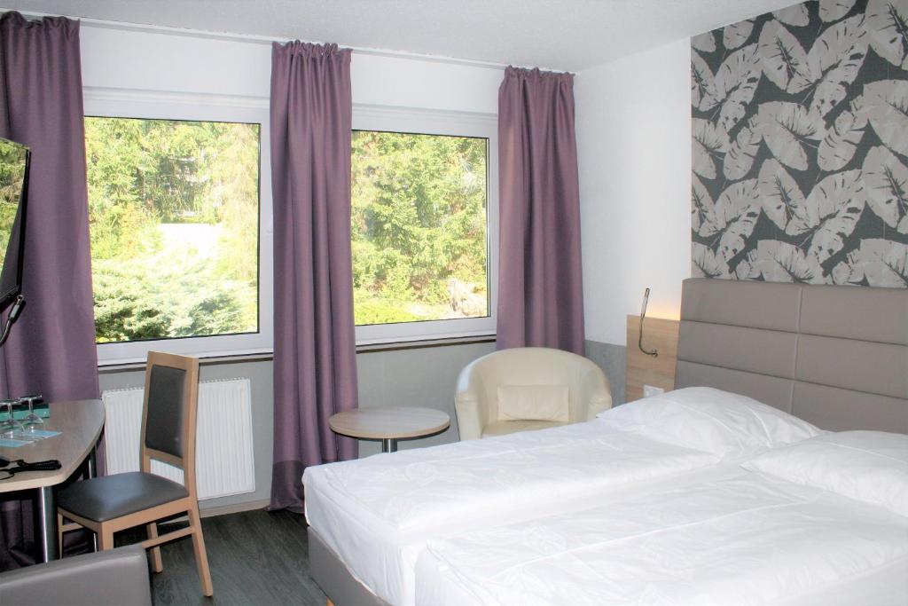 Postel nebo postele na pokoji v ubytování Hotel Erlenstegen