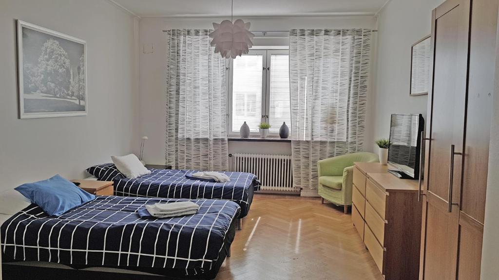 Postel nebo postele na pokoji v ubytování City Apartments Triangeln