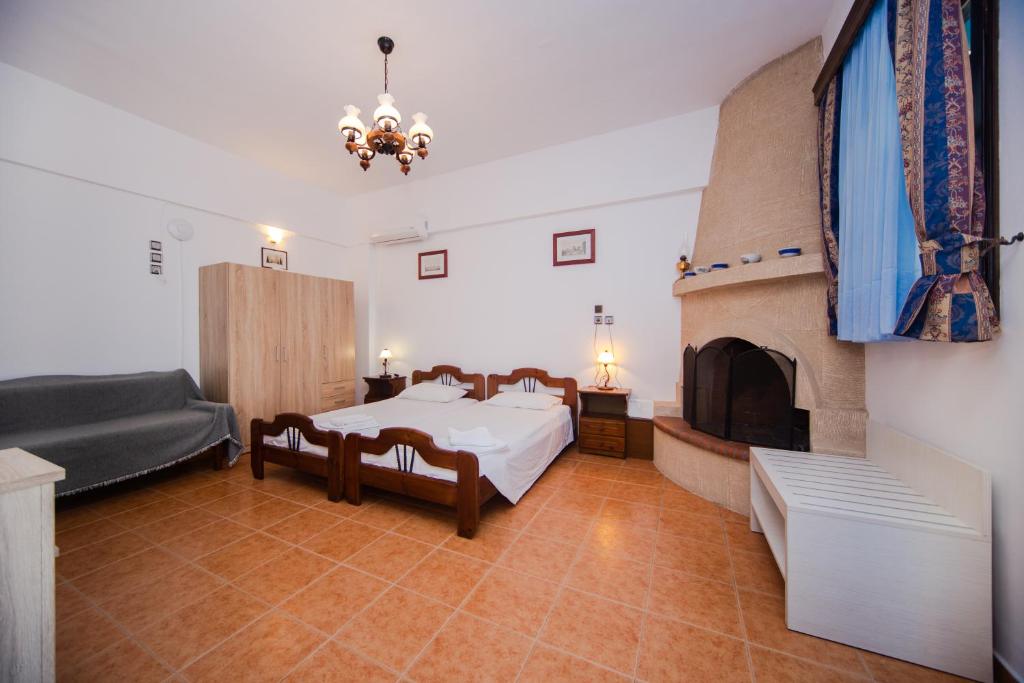 A bed or beds in a room at Stegnailion