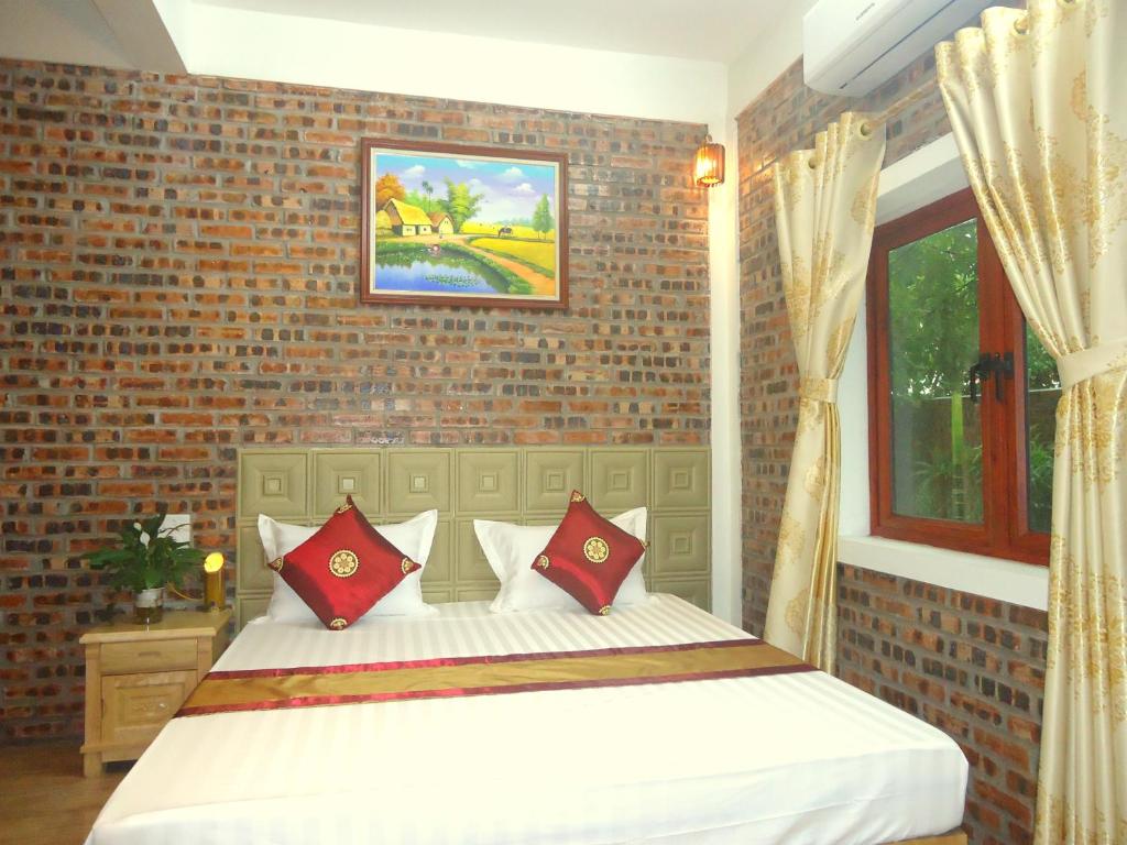 Postel nebo postele na pokoji v ubytování Green Space Homestay