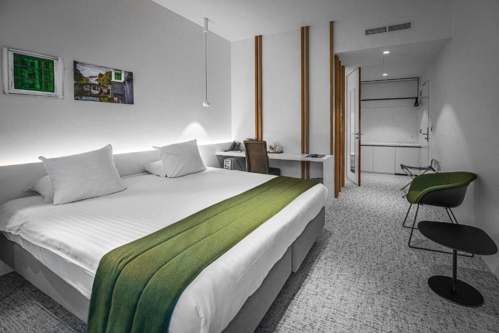 Postel nebo postele na pokoji v ubytování Hotel Bourgoensch Hof