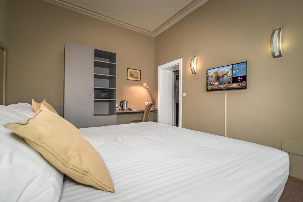 Postel nebo postele na pokoji v ubytování Hotel Bourgoensch Hof