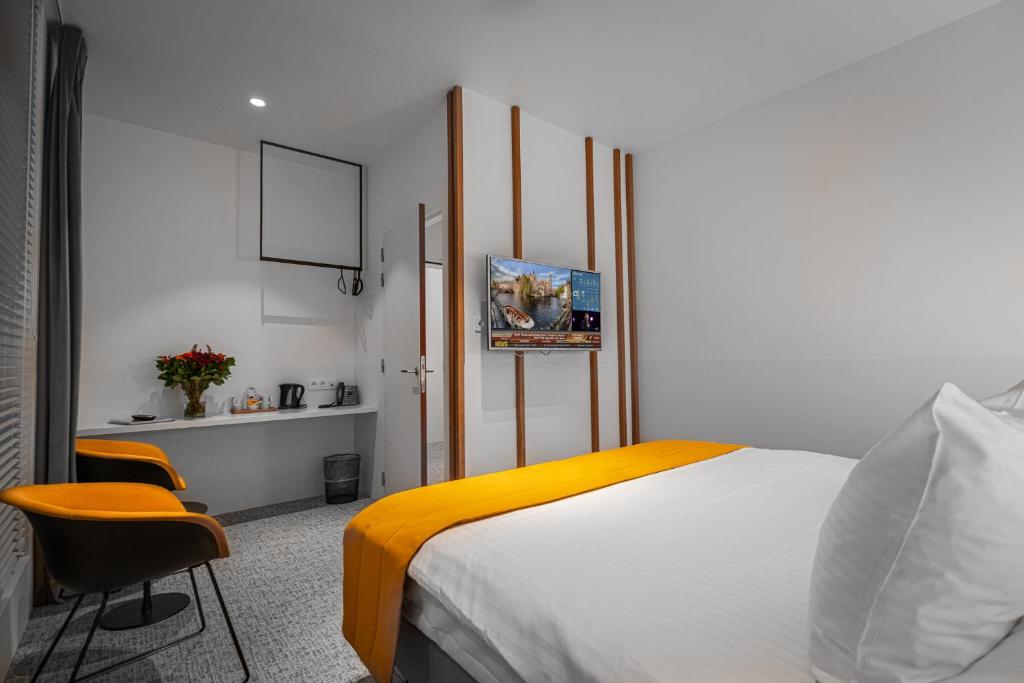 Postel nebo postele na pokoji v ubytování Hotel Bourgoensch Hof