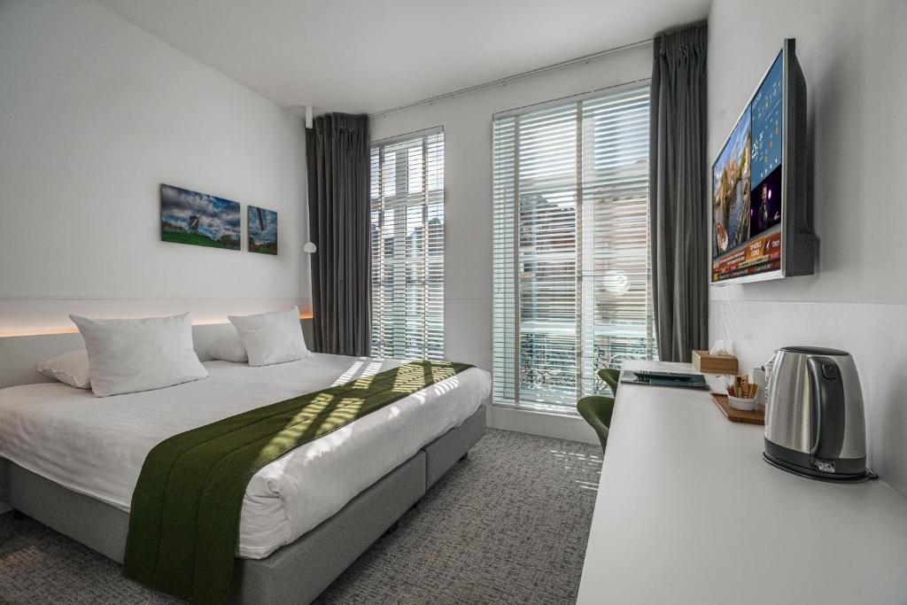Postel nebo postele na pokoji v ubytování Hotel Bourgoensch Hof