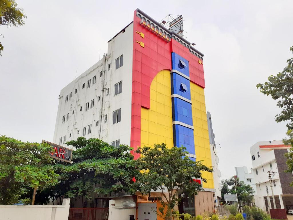 a building with a rainbow painted on the side of it at Aakash Residency in Madurai