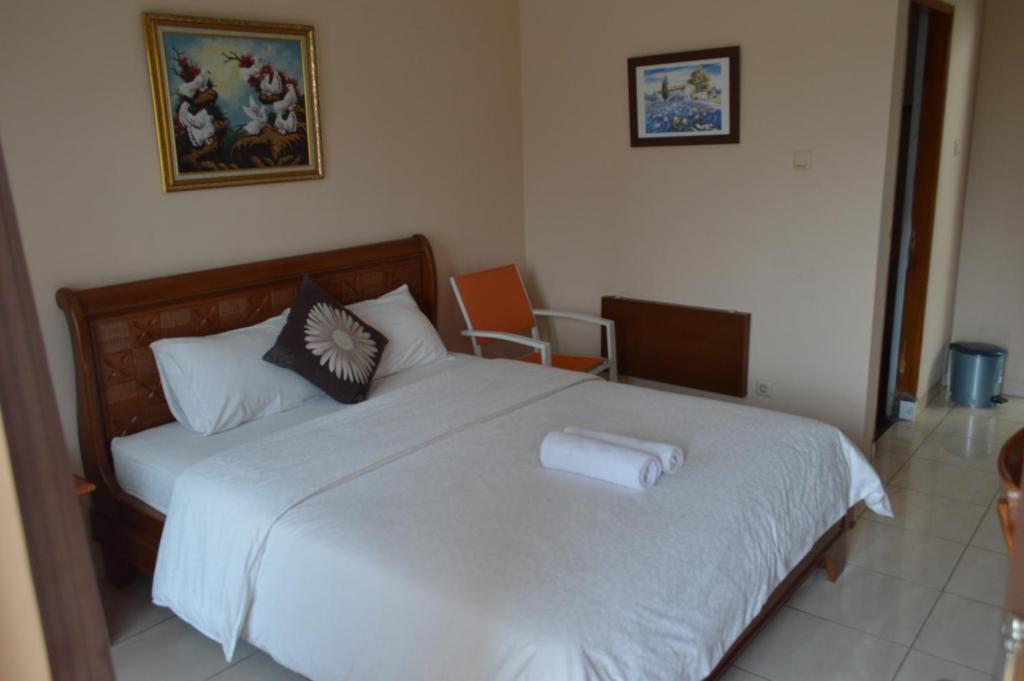 Postel nebo postele na pokoji v ubytování Hotel Lurus