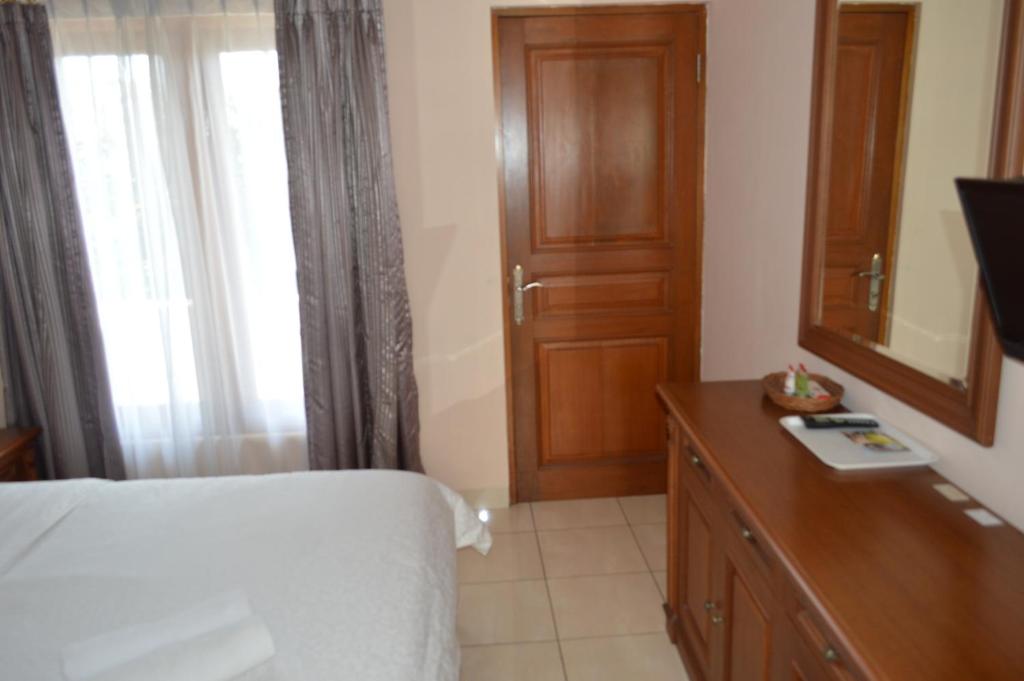 Postel nebo postele na pokoji v ubytování Hotel Lurus