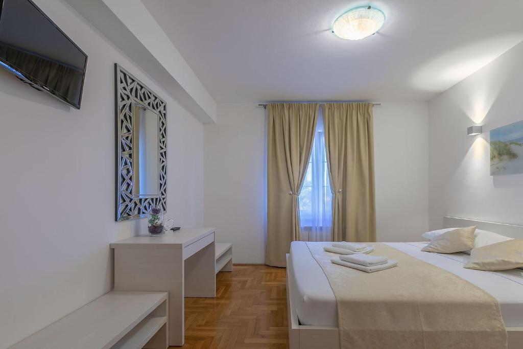 Postel nebo postele na pokoji v ubytování B&B-Ld