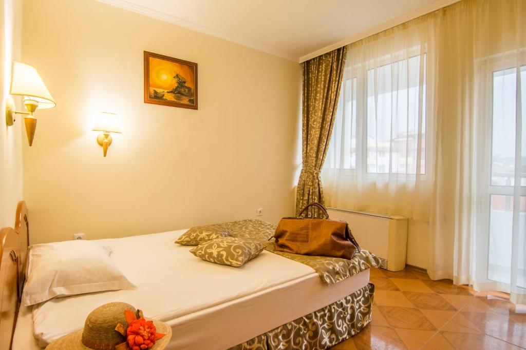 Postel nebo postele na pokoji v ubytování Hotel Villa List