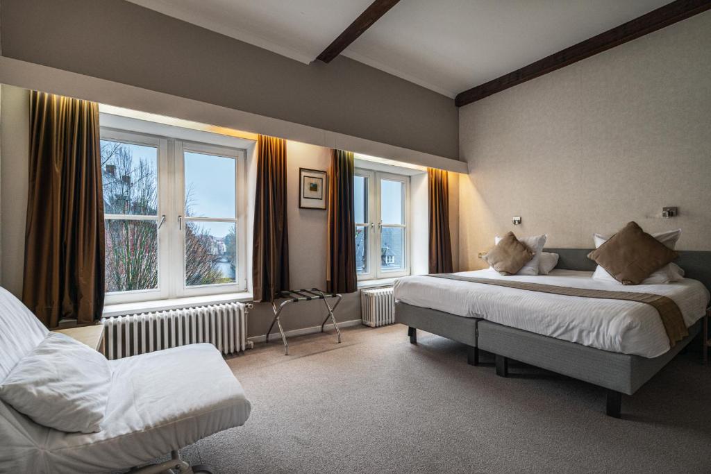 Postel nebo postele na pokoji v ubytování Hotel Bourgoensch Hof