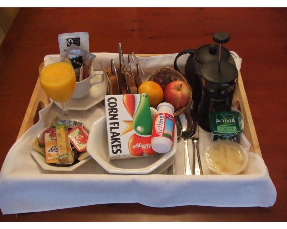 a tray with breakfast foods and drinks on it at 31 Queens Road in Winchester