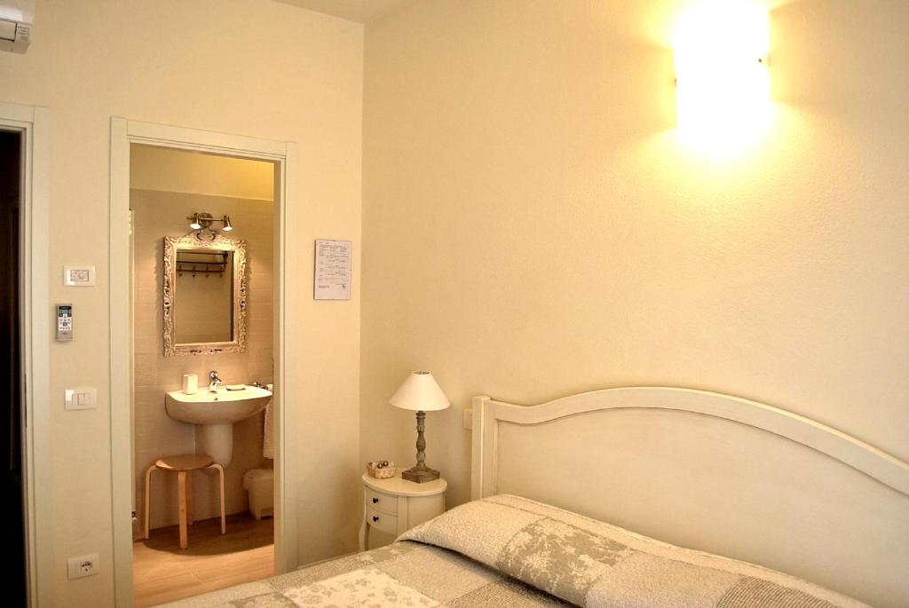 Postel nebo postele na pokoji v ubytování B&B Villa Bianca