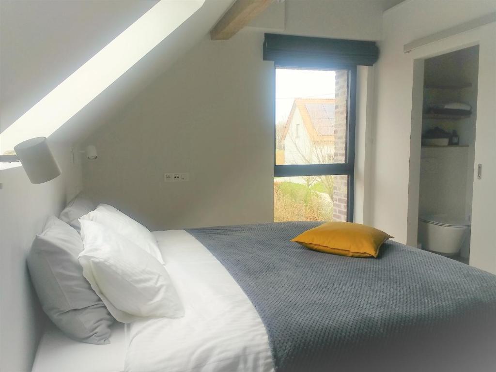 Postel nebo postele na pokoji v ubytování B&B De Woestijn