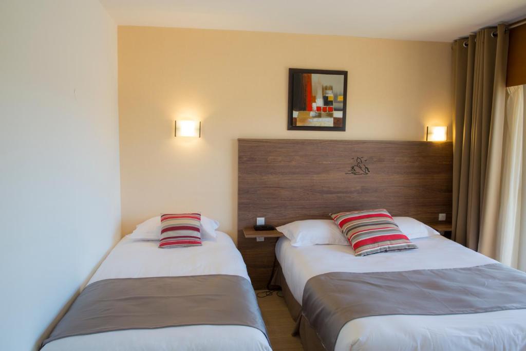 Postel nebo postele na pokoji v ubytování Arc Hôtel Sur Mer