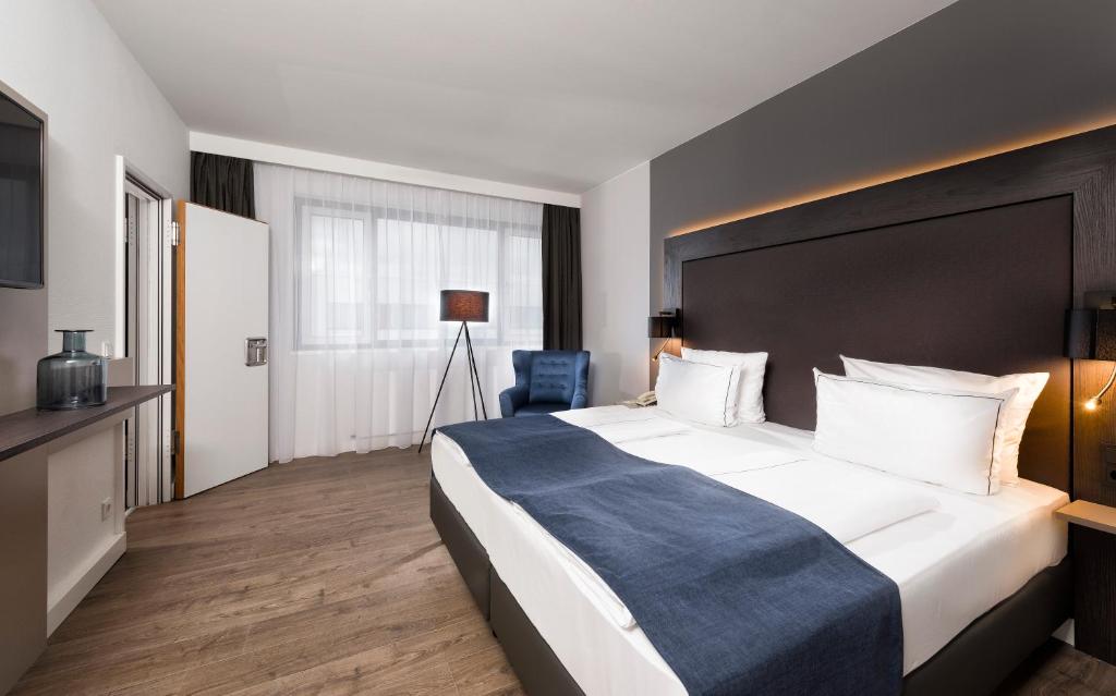 Postel nebo postele na pokoji v ubytování Holiday Inn Berlin City-West by IHG
