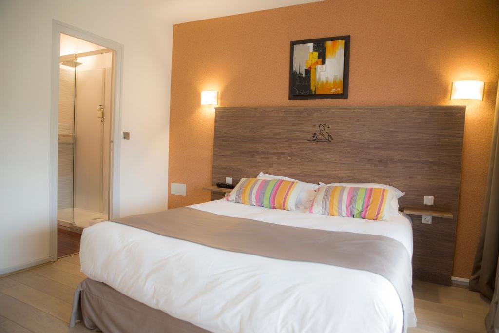 Postel nebo postele na pokoji v ubytování Arc Hôtel Sur Mer