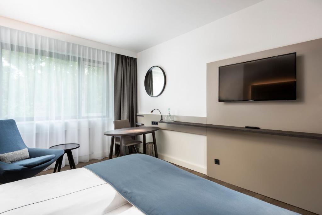 TV a/nebo společenská místnost v ubytování Holiday Inn Berlin City-West by IHG