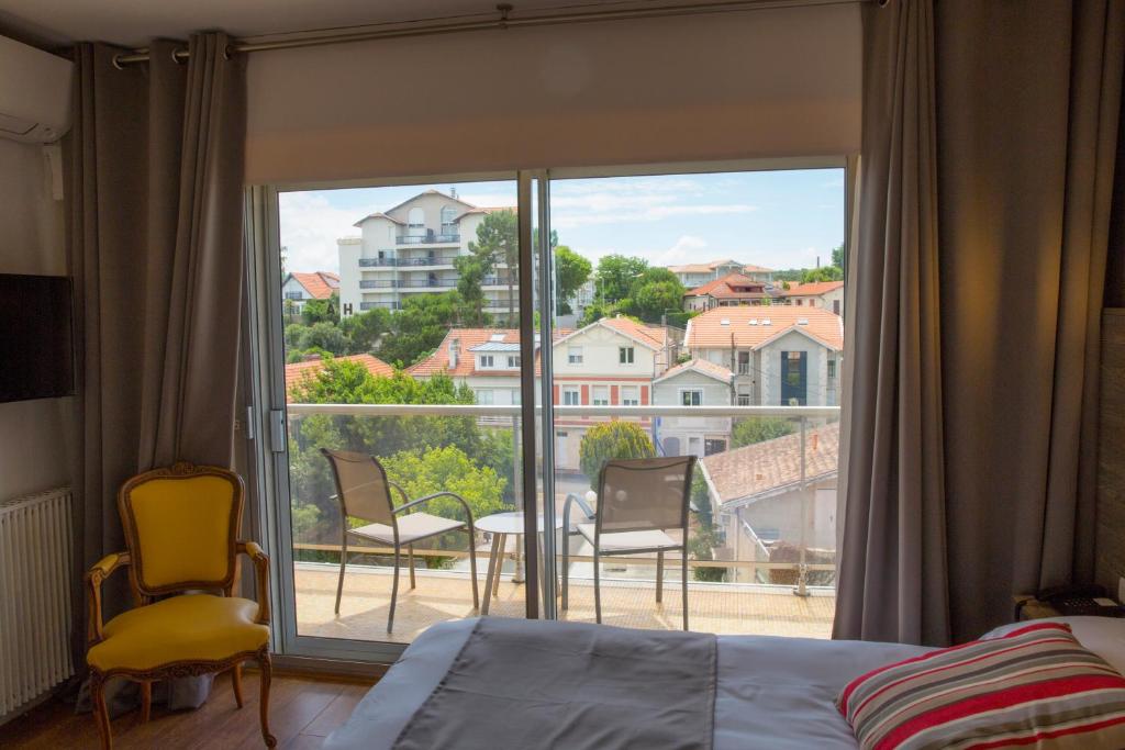 Postel nebo postele na pokoji v ubytování Arc Hôtel Sur Mer
