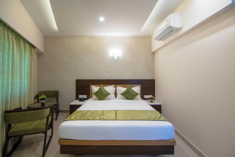 Postel nebo postele na pokoji v ubytování Hotel Kheni