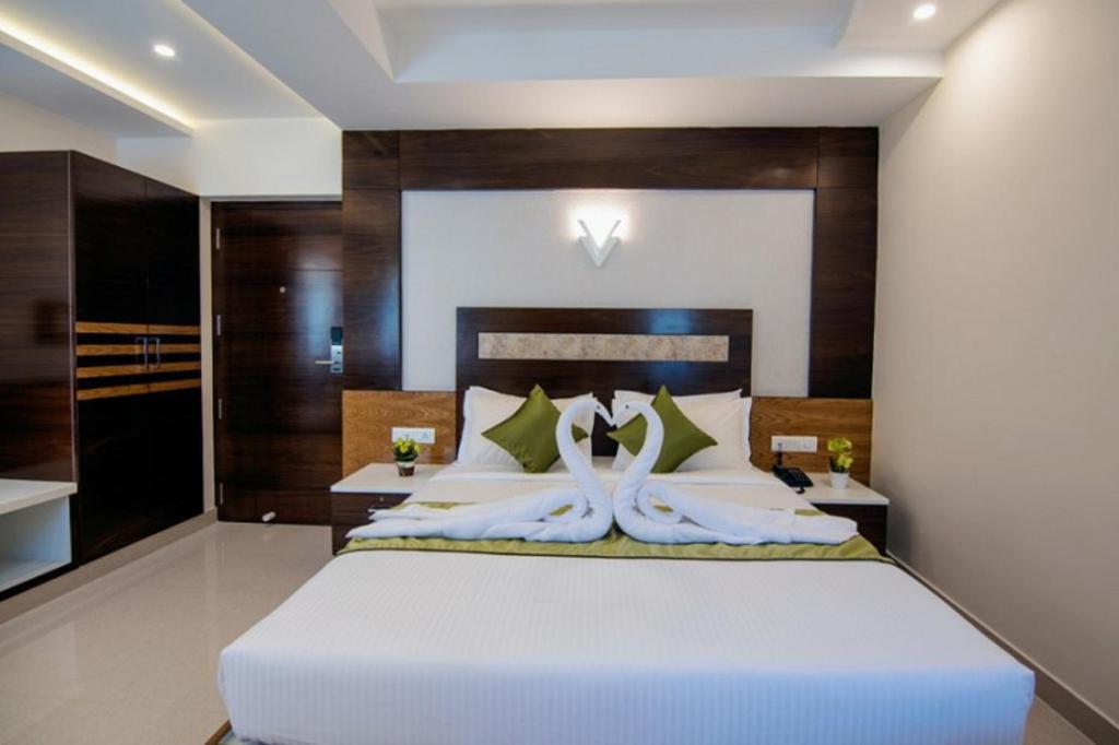 Postel nebo postele na pokoji v ubytování Hotel Kheni