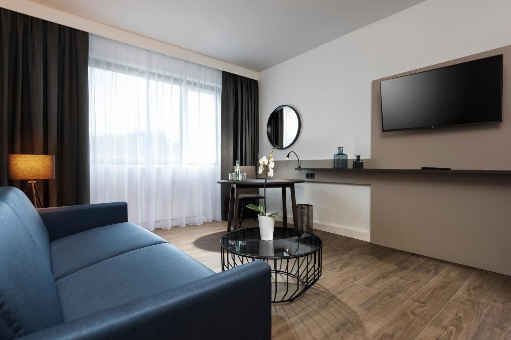 TV a/nebo společenská místnost v ubytování Holiday Inn Berlin City-West by IHG