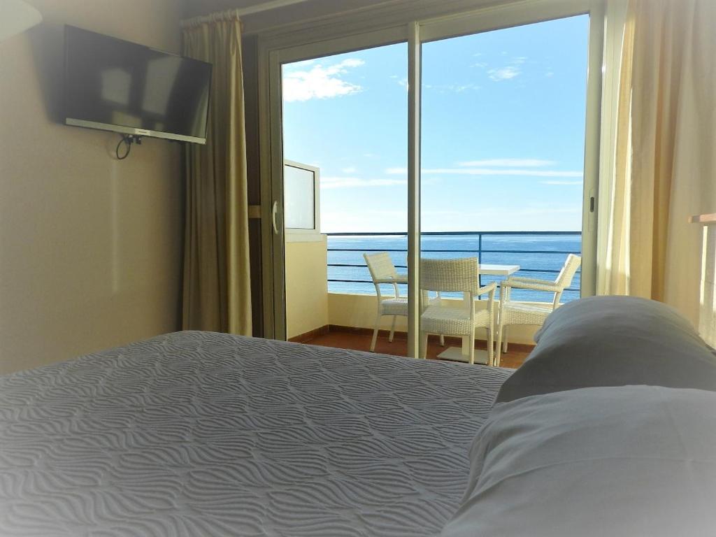 Postel nebo postele na pokoji v ubytování Grand Hotel Moriaz